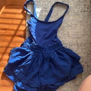 Blue free people movement unitard/onezie with ruffle skirt and cross back